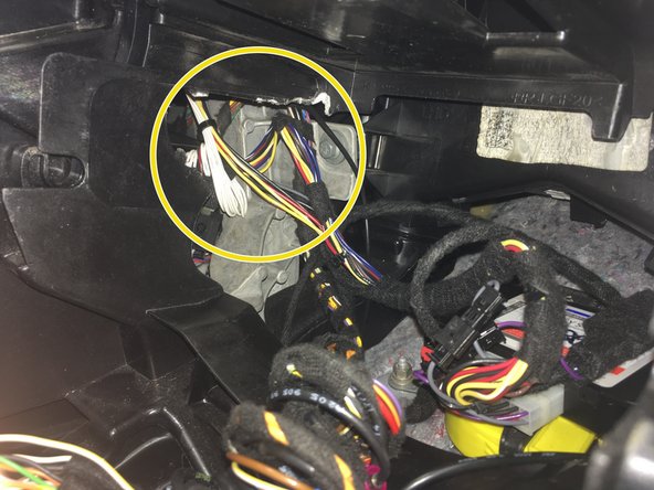 On the left side of the radio cavity there is a plastic grill.  A small piece of plastic must be cut out of this grill to create a large enough opening for the EIS (electronic ignition switch) to be removed through