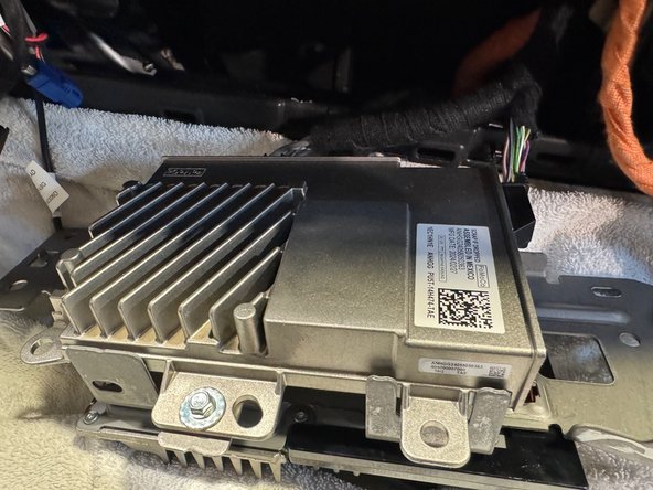 There is a bracket holding both the radio control module and the gateway module. Remove bracket and pull both modules from dash cavity