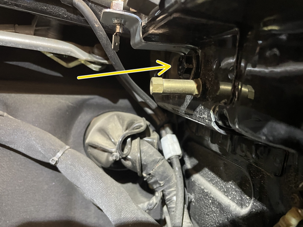 Mount hood pin and bracket under hood in location shown in picture. When hood is opened, the hood pin should be grounded