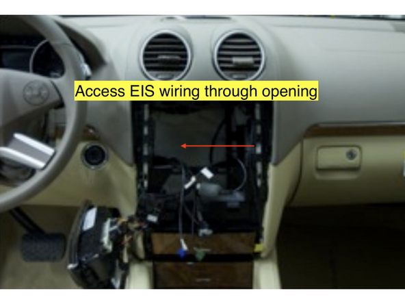 Reach through the radio cavity and locate the rear of the EIS module. The EIS is the key switch.
