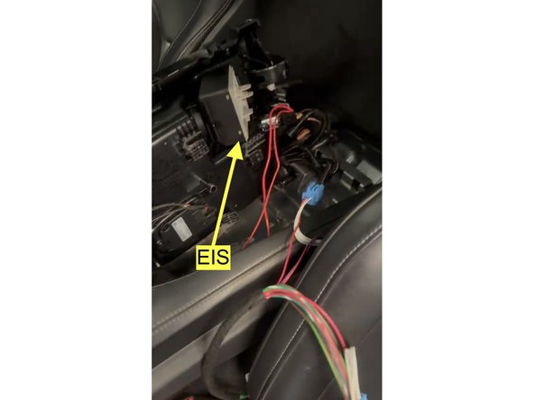 Access EIS module behind center console