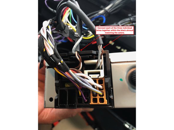 Disconnect the 8 pin black plug from the OEM radio harness