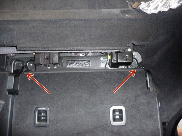 Remove two (2) additional bolts that hold the driver’s side rear seat back.