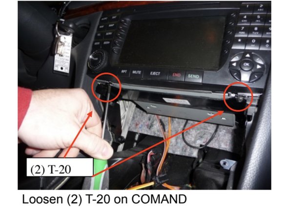 Loosen (2) T-20 screws from the bottom side of the COMAND until they stop.