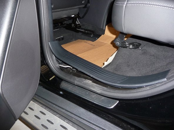 Remove the driver’s rear door sill plate.