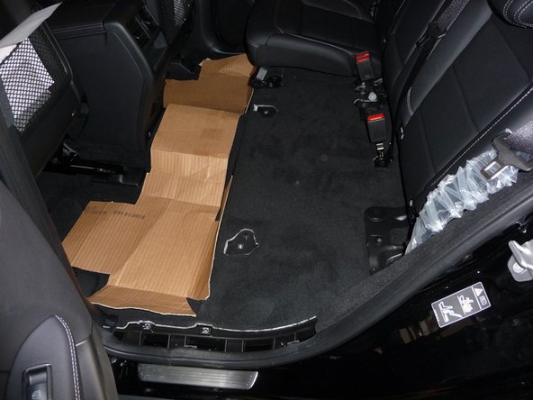 Remove the driver’s side rear seat bottom from the vehicle.