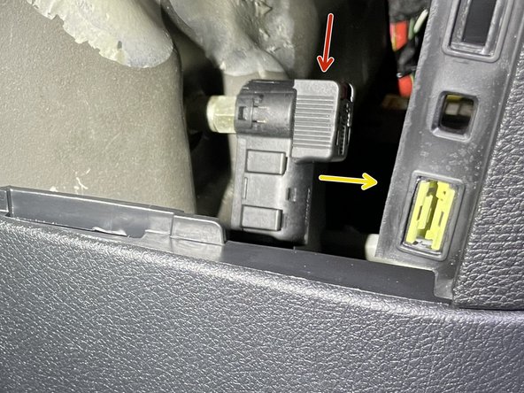 There is a red tab on the top of the disconnect cable. To release the cable from the post, the red tab needs to be pushed downward