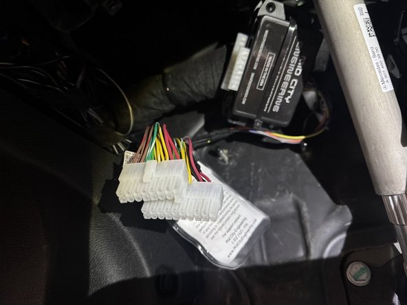 Un-plug the SmartKey Starter and SKSPCM modules from the T-harnessing