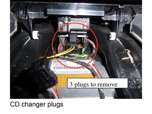 Unplug (3) plugs below the CD changer behind the ashtray cavity.