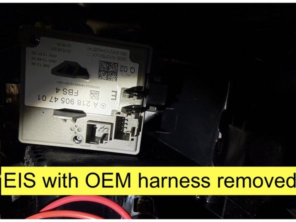 Access EIS module behind center console