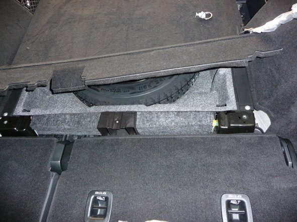 Remove the cargo cover.