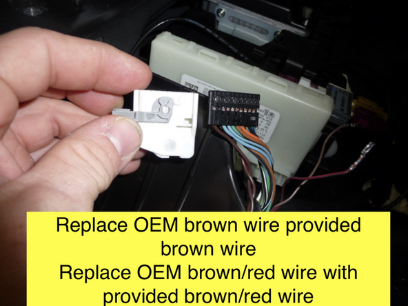 Locate twisted pair of brown and brown/red wires at the Keyless Go module. Unlatch and unplug connector. Remove connector shroud.