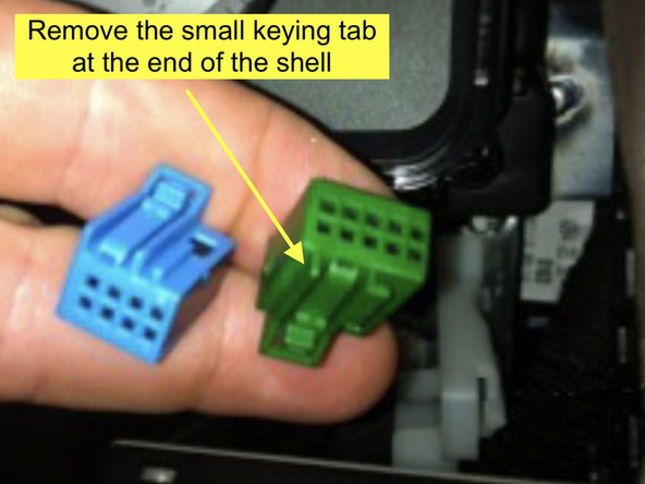 There is a small keying tab on the top of the connector. Using a small cutting tool, carefully cut off the keying tab flush with the shell of the connector. See pictures.