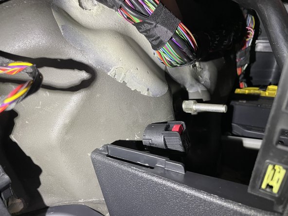 Remove access panel above and to the right of the accelerator pedal