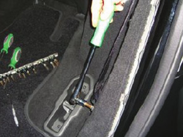 Remove torx bolt holding seat belt to rear side panel.