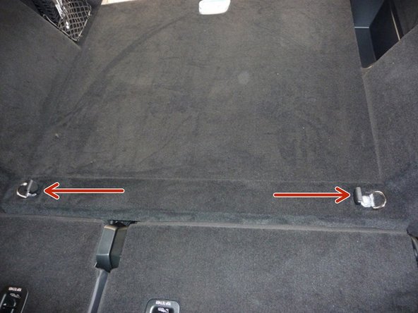 Remove the bolts from each tie down and remove the hooks from their mounts.