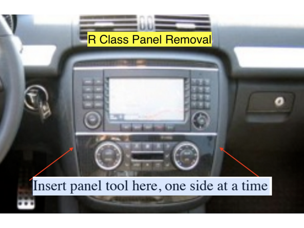 Remove the panel and place it to the left being careful not to scratch the console or the wood grain front. For an R class, insert a panel tool on the left and right upper edges of the HVAC panel and release the clips, then remove the panel by pulling out the top first then pulling up on the entire panel to release the lower clips.