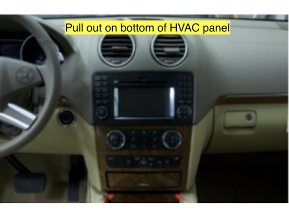 Remove the HVAC panel by pulling outward to release the lower clips.