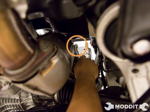 Remove bolts holding the heat shield