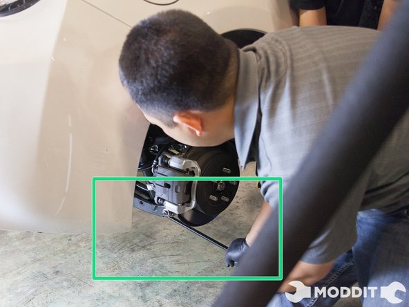 New line.At this point you can begin removing the oem suspension from the car. You will have to put some force on the rear suspension/rear control arm to have enough clearance to remove the OEM strut assembly from the rear. This especially true if one has not removed the sway bar link.