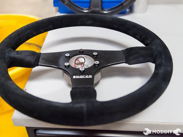 Line up the top marker of the quick release to be on top of the new steering wheel to make sure its straight.