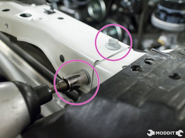Using a 12mm socket, remove the four bolts securing the top of the radiator support to the vehicle.