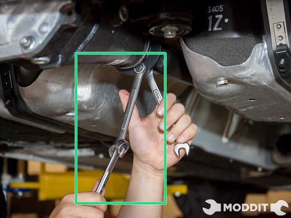 Use 2 14mm wrenches to do this