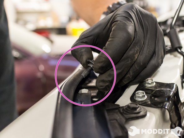 After this there are a couple of beefty clips to remove. Go ahead and take those off as well.