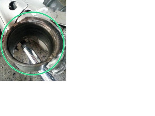 When all rubber bushings are removed, clean out the holes that the bushings were pressed out of. The holes should look like what is pictured.