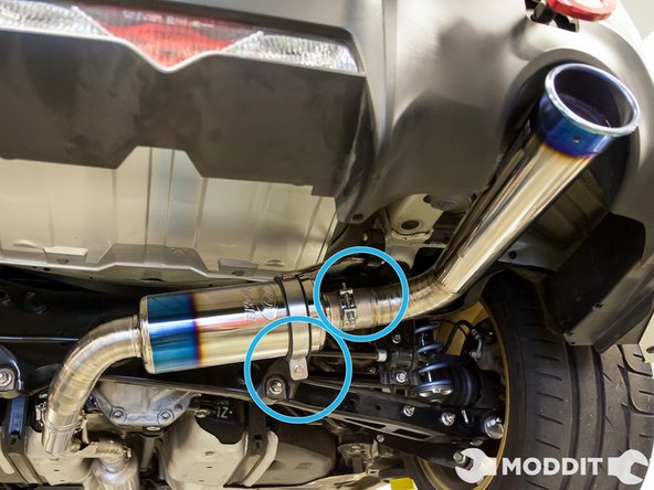 Once those are tight, look at where the tip is sitting and if its perfectly centered or how you like it, go ahead and tighten the hanger on the muffler itself.