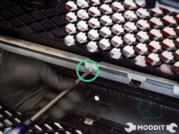 Just line up the tabs to the holes and click it into place.