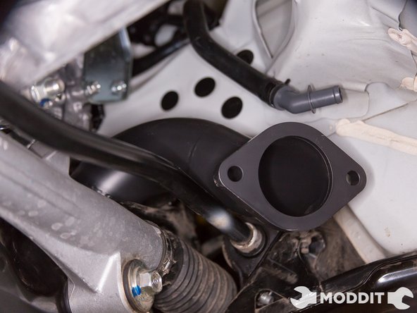 Once the over pipe is loosely connected to the header, go ahead and connect the down pipe on the back of the over pipe.