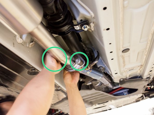 After tightening the clamps, go ahead and tighten the bolts that hold the midpipe and front pipe together.