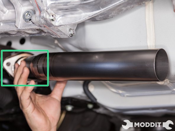 Utilizing factory hardware to overpipe, secure but do not tighten the front section of the tomei front pipe.