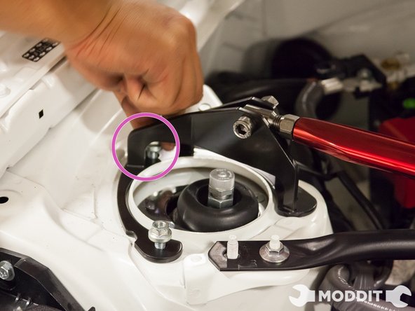 Now that you have a couple bolts somewhat holding the bar, go ahead and screw them on a bit tighter by hand so that you can better adjust the Tanabe Strut Bar.