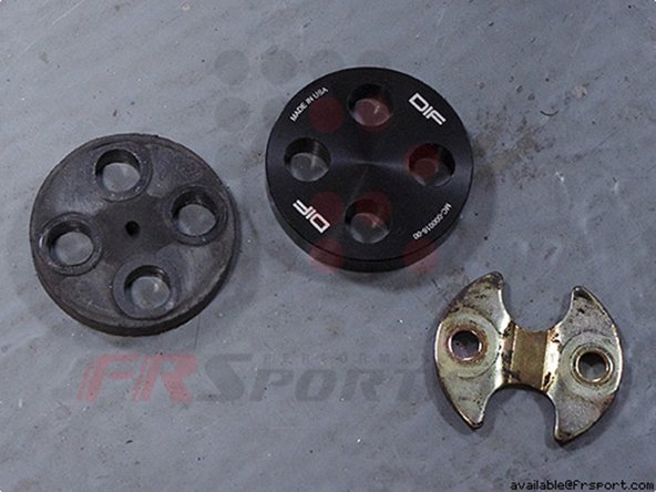 Remove the nuts and metal/plastic spacers on the OEM power steering column bushing.