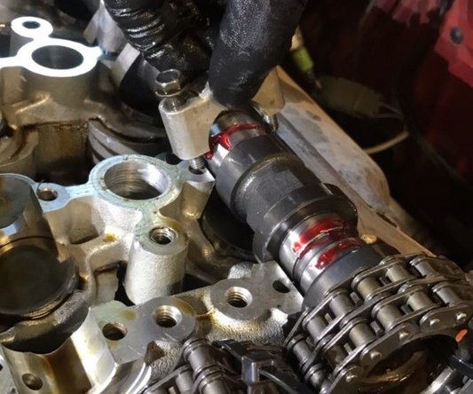 Inspect factory camshaft cap bolt. Many times these have stretched and need to be replaced. We normally like to see them new as time has taken its toll on them.