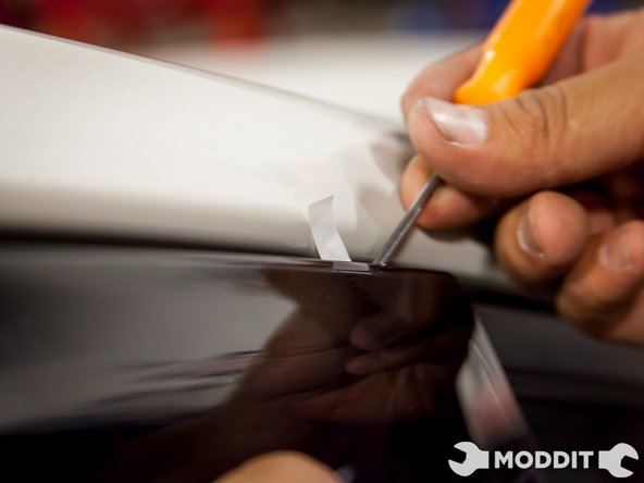 Removal of the tape backing officially installs the visors on the vehicle.