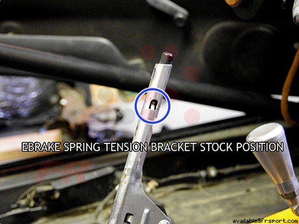 There are 2 brackets on either side of the ebrake mechanism. Use one flat head screwdriver to push and hold the spring out of the way while you pull the metal brackets on each side with another flat head screwdriver.