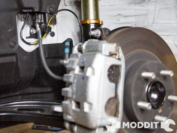 Once you are completely finished removing the front suspension work backwards in order to install the Stance alternative.
