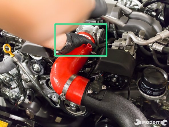 Install the Perrin intake hose, throttle body side first.