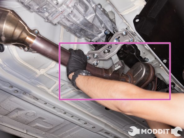 With the front pipe being supported by the hook on the center bracket, separate the front pipe from the catback.