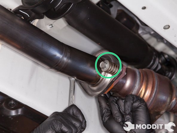 Once the flanges are lined up, start threading the bolts and springs.