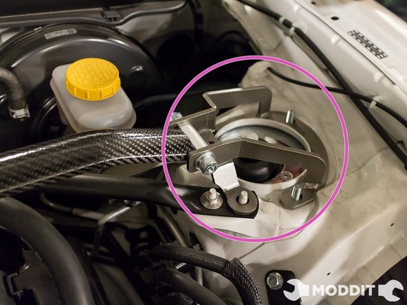 After removing all the necessary nuts, go ahead and place the strut bar on the towers. Aligning the holes on the strut bar with the stud on the towers.