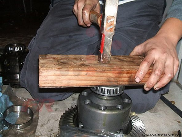 Step 10 With a hammer and a piece of wood, hammer in evenly the new bearing on the new differential.