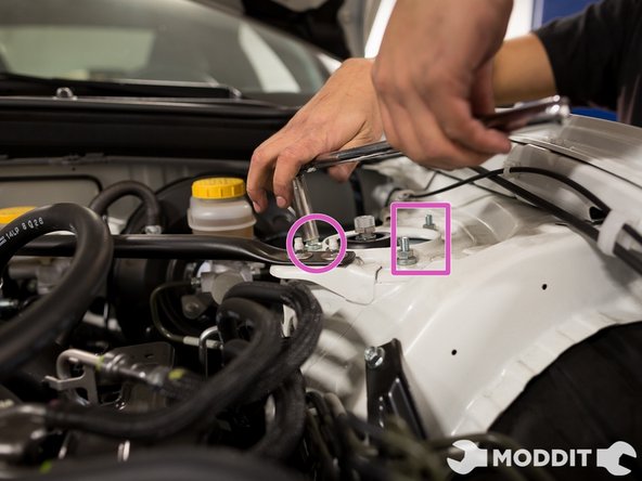 Then the strut mounts inside the engine bay. Those definitely need to be tightened as well.