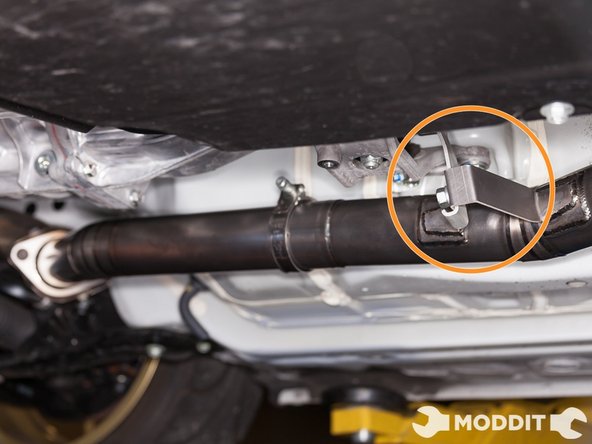 Secure front pipe to transmission support bracket.