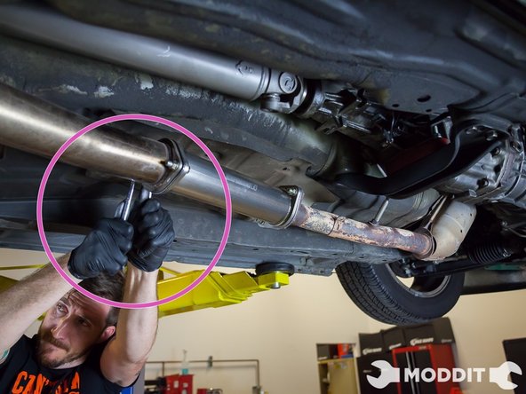 Using a 14 mm socket and 14 mm box end wrench start tightening the Tomei Ti   Test Pipe Down.