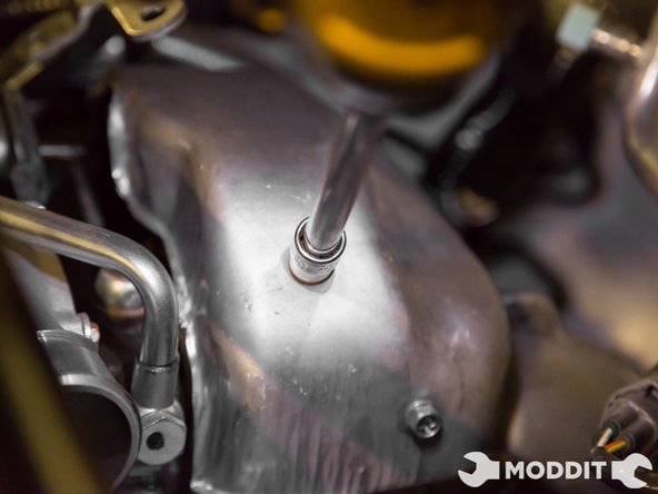 There is one bolt behind the turbo not easily seen or accessible. Please note the location in the picture; located using a cell phone camera