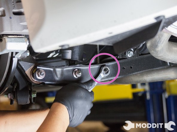 Then we disconnected the rear sway bar end link from the sway bar with a 14mm wrench and 6mm allen wrench to keep the end link from spinning.